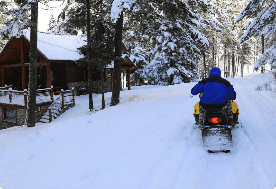 A person riding a snowmobile