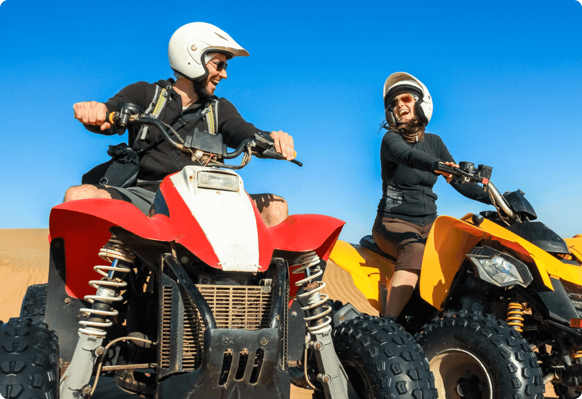 Two couple sitting on two separate quads