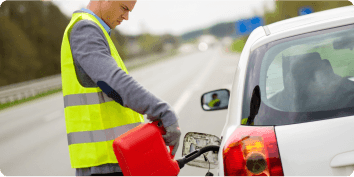 a man putting gas into a stranded car