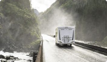 RV going down on a wet road