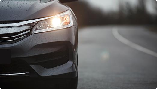 a close up of a car's headlight