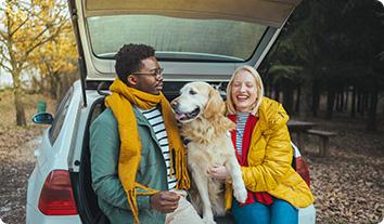 a man and woman with a dog