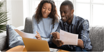 Couple reading documents together