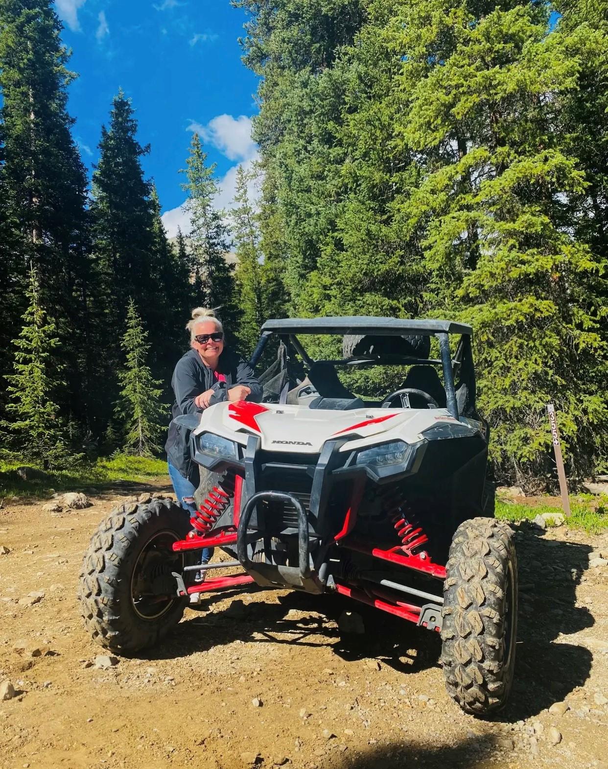 a man sitting on a jeep