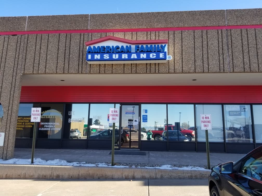 a store front with a blue sign