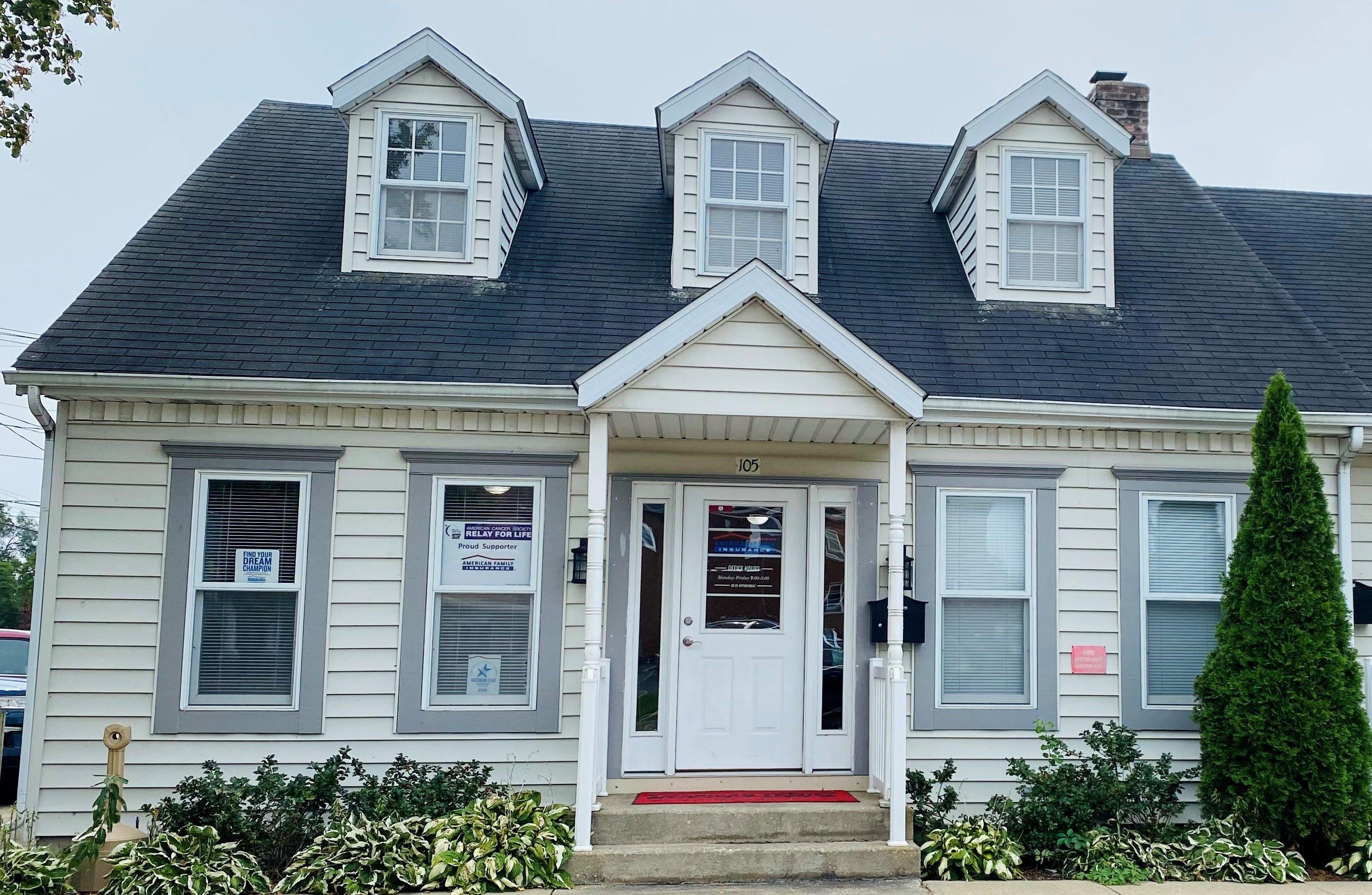 a house with a sign on the front