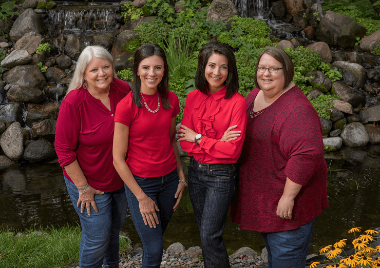 a group of women posing for a photo