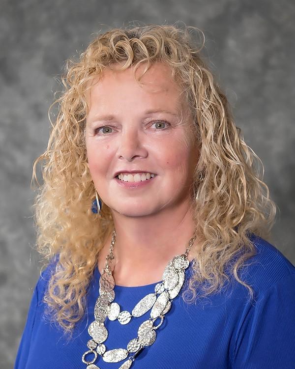 a woman with curly hair