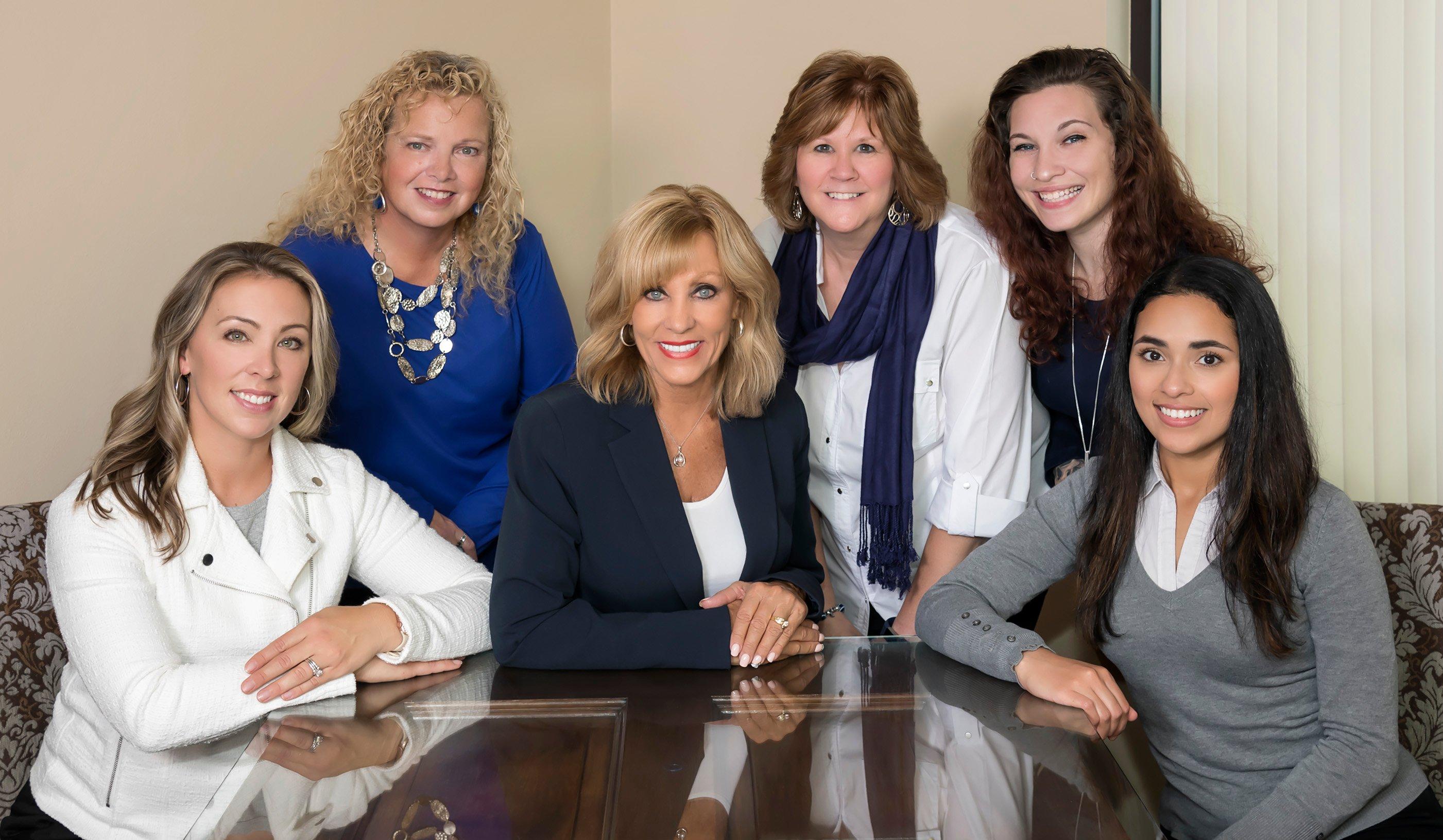 a group of women posing for a photo