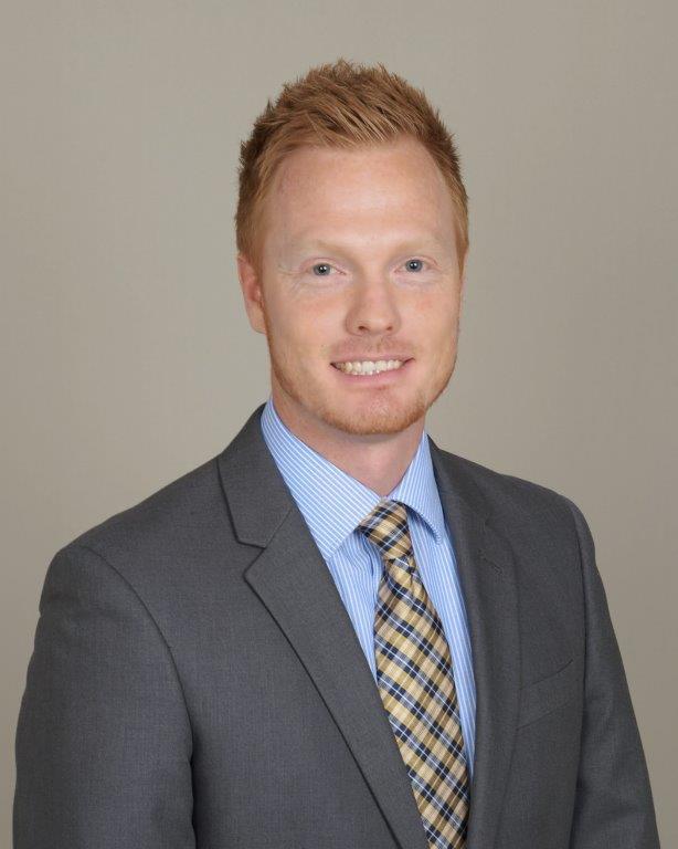 a man in a suit smiling