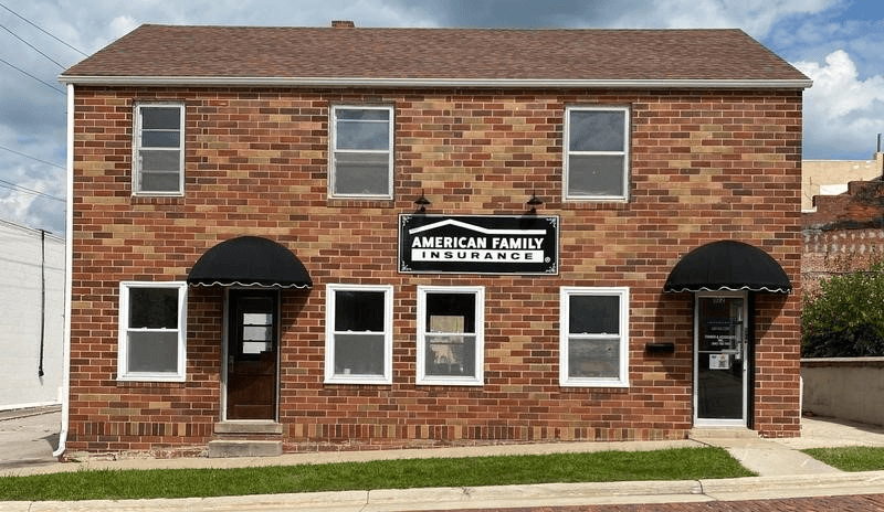 a brick building with a sign on it