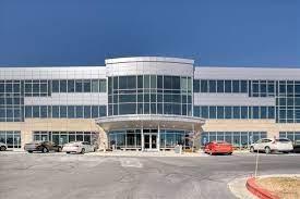 a building with cars parked in front