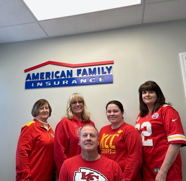 a group of people wearing red shirts