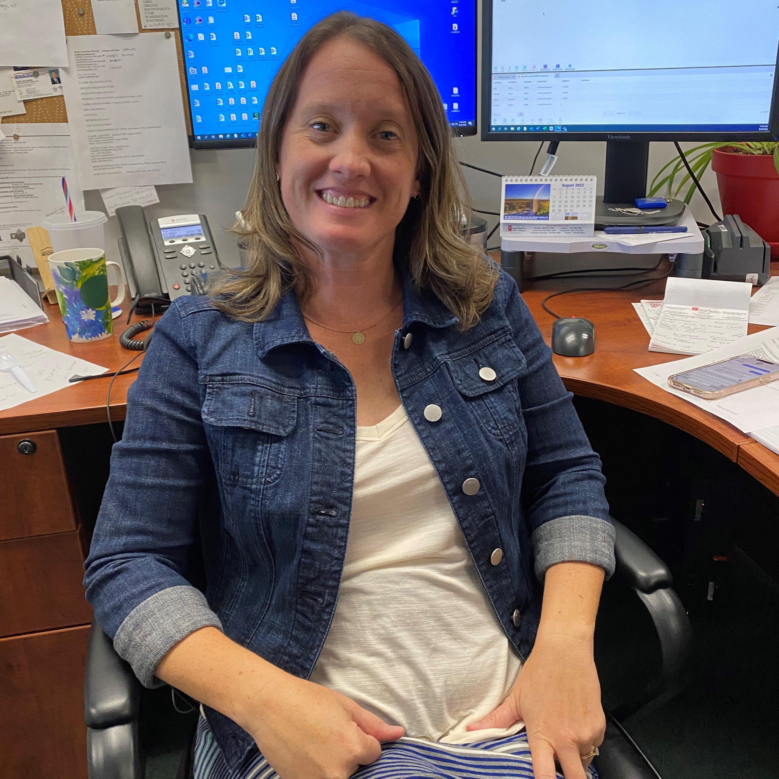 a woman sitting at a desk