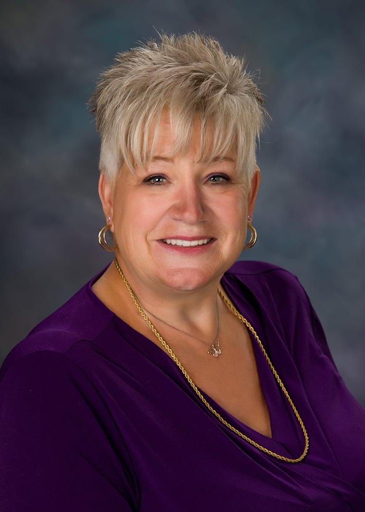 a woman wearing a purple dress