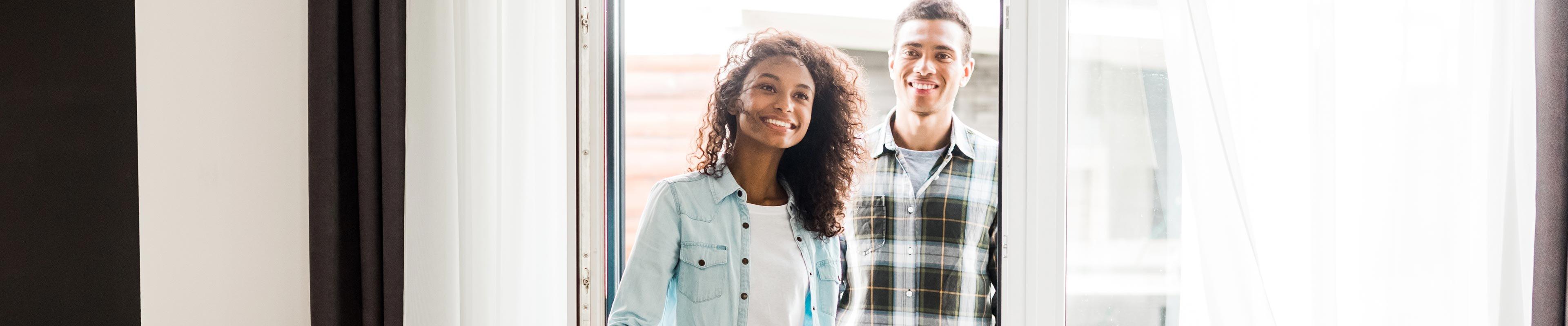 Image of a young couple viewing a home to rent.