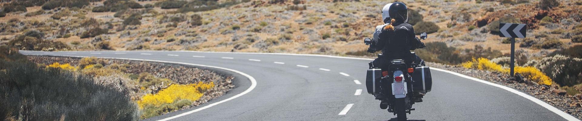 a person riding a motorcycle on a road