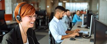 a group of people in a computer room