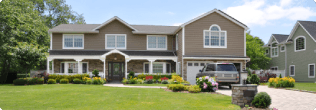 A single house with a parked card in the driveway