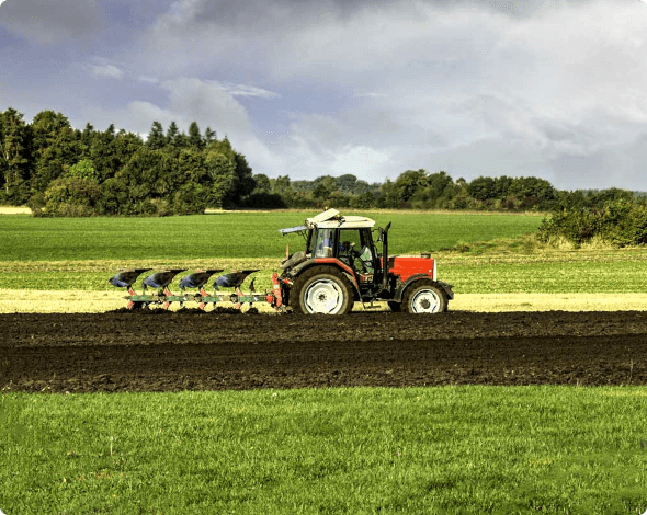 a tractor plowing a field