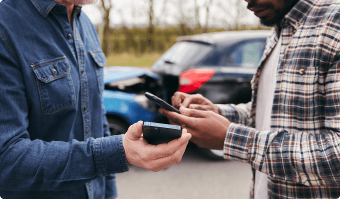 People exchanging info after a car accident