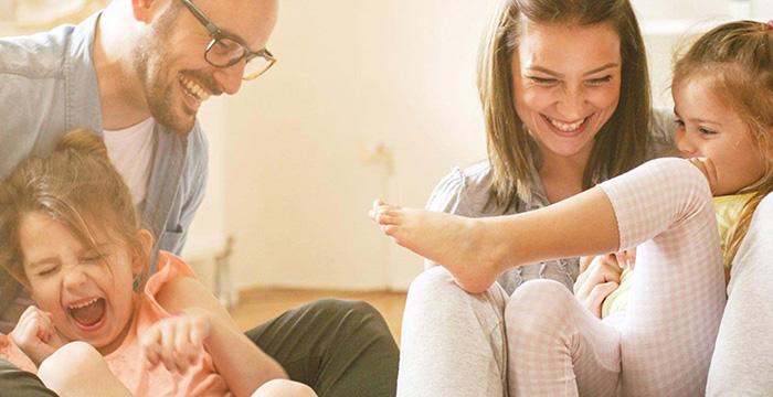 a family sitting on the floor