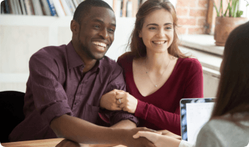 Couple talking with an agent