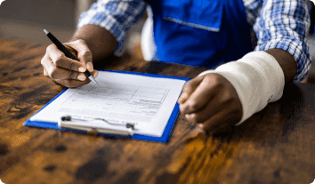 a person writing on a piece of paper