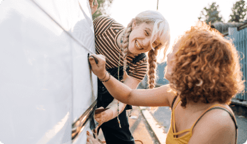 a woman painting a picture